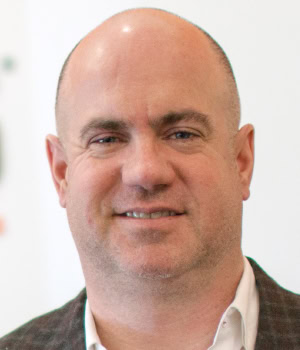 Headshot of Greg Burns, Chairman & CEO, PLS Logistics.
